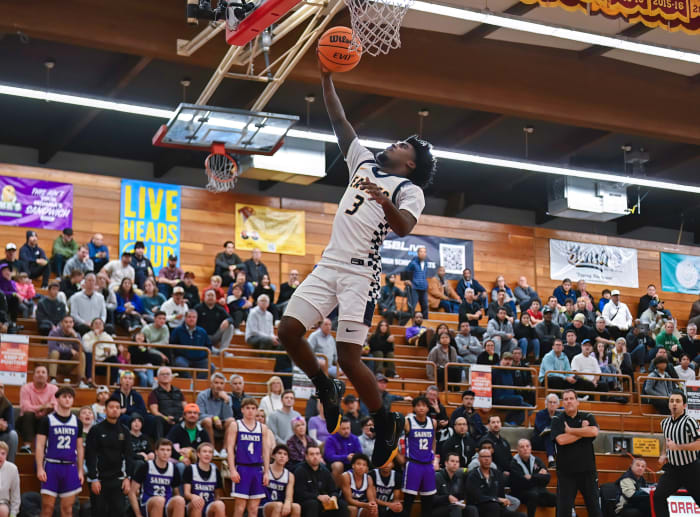 Jazz Henderson (3) swoops in for another deuce. He finished with 14 points.